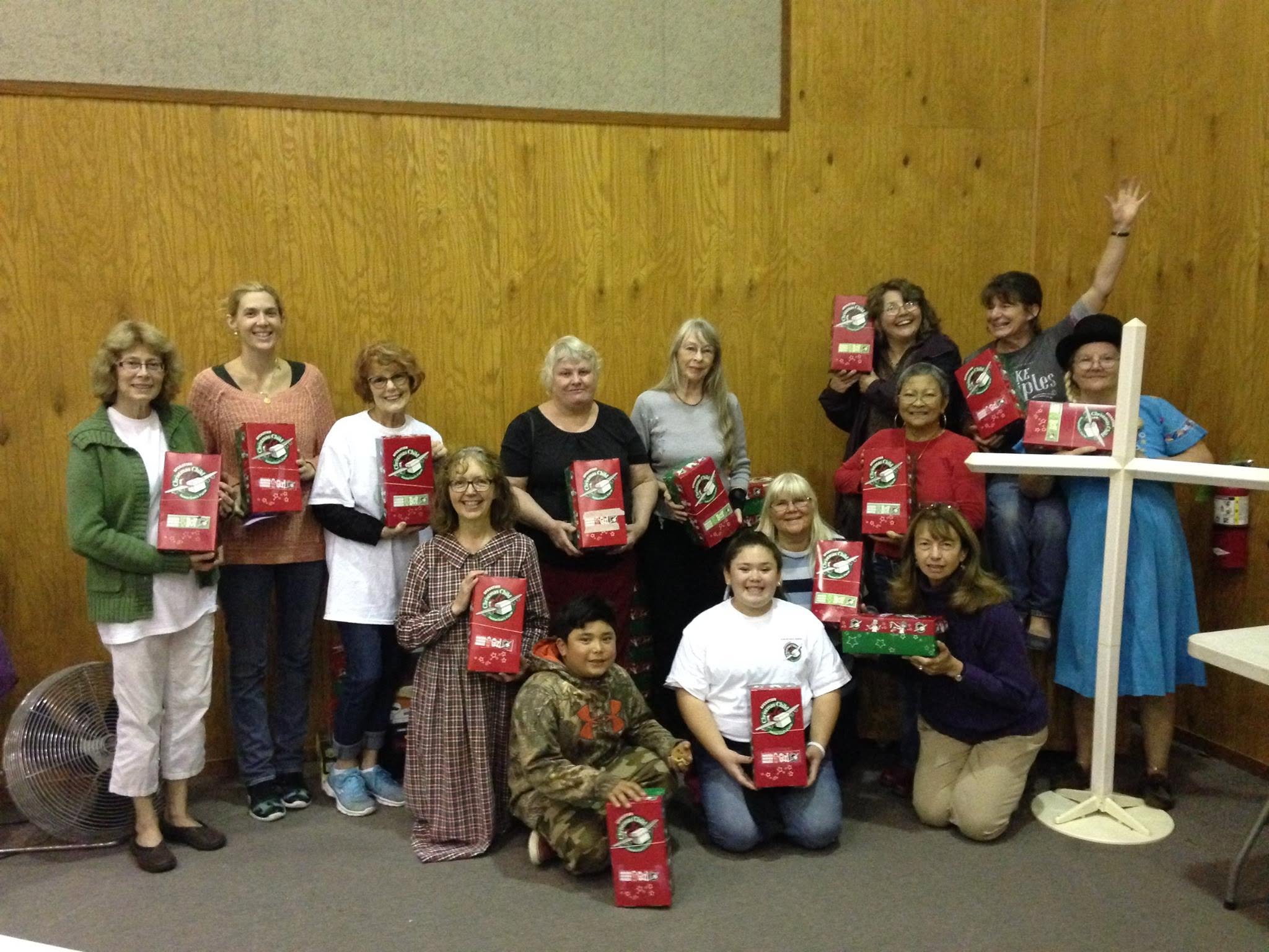 Church members with Operation Christmas Child gift boxes
